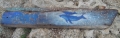 whale on weathered plank -